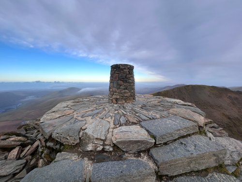 Blueness opening above the summit
